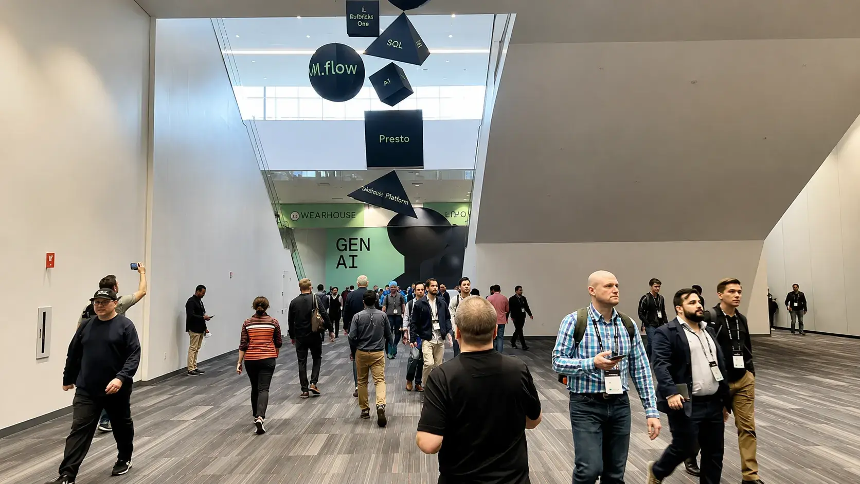 Attendees heading into AI conference sessions