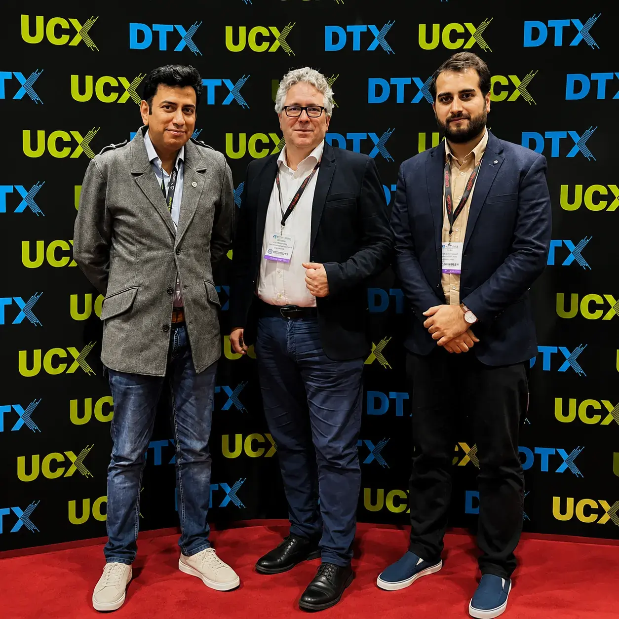 Grayphite representatives with an industry contact at DTX Europe 2023