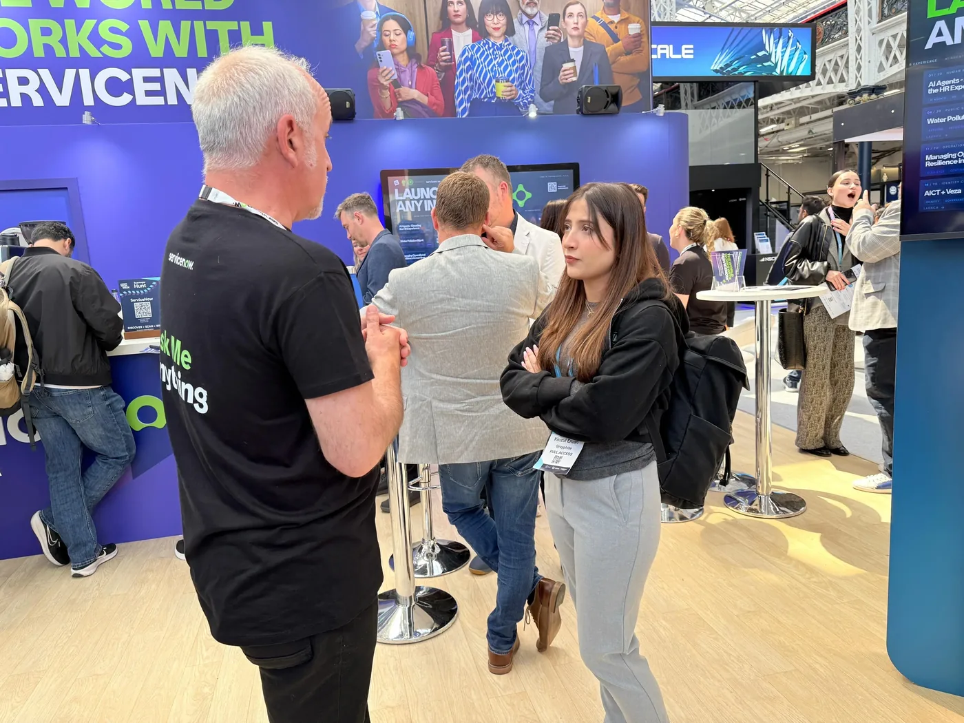 Eiman representing Grayphite in conversation with an exhibitor at London Tech Week 2026